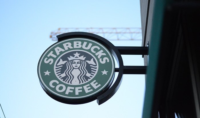 Starbucks promises 100% pay equality across globe after hitting landmark in US